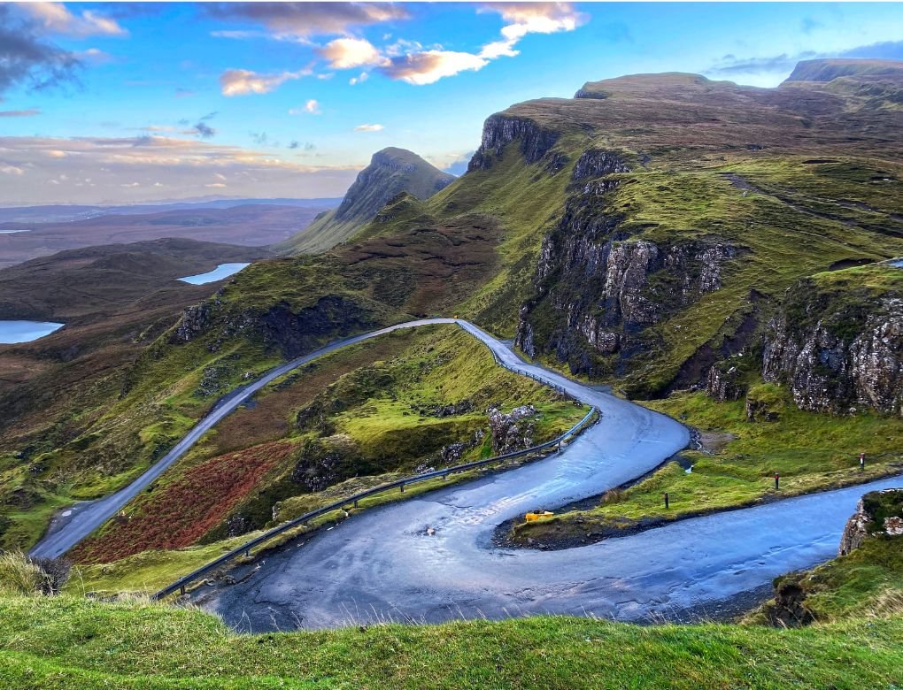 A winding road that climbs to the Quiraing Trailhead