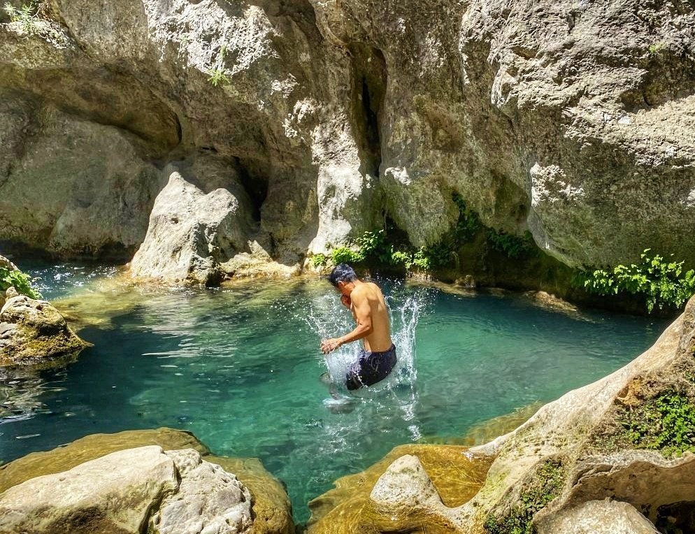 Trin jumping into the river in the Talassemtane National Park