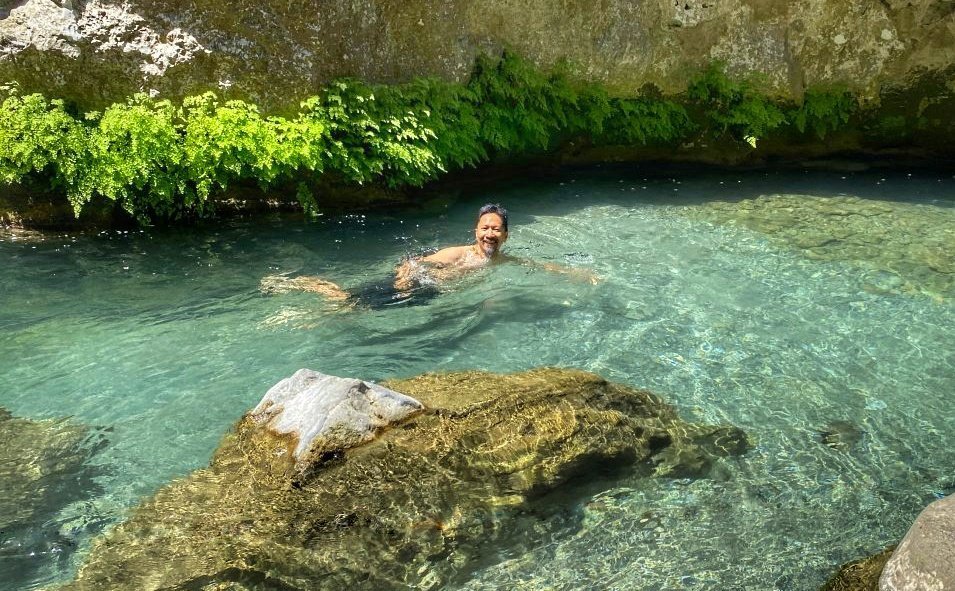 Trin swimming in the clear water of the river in Talassemtane National Park