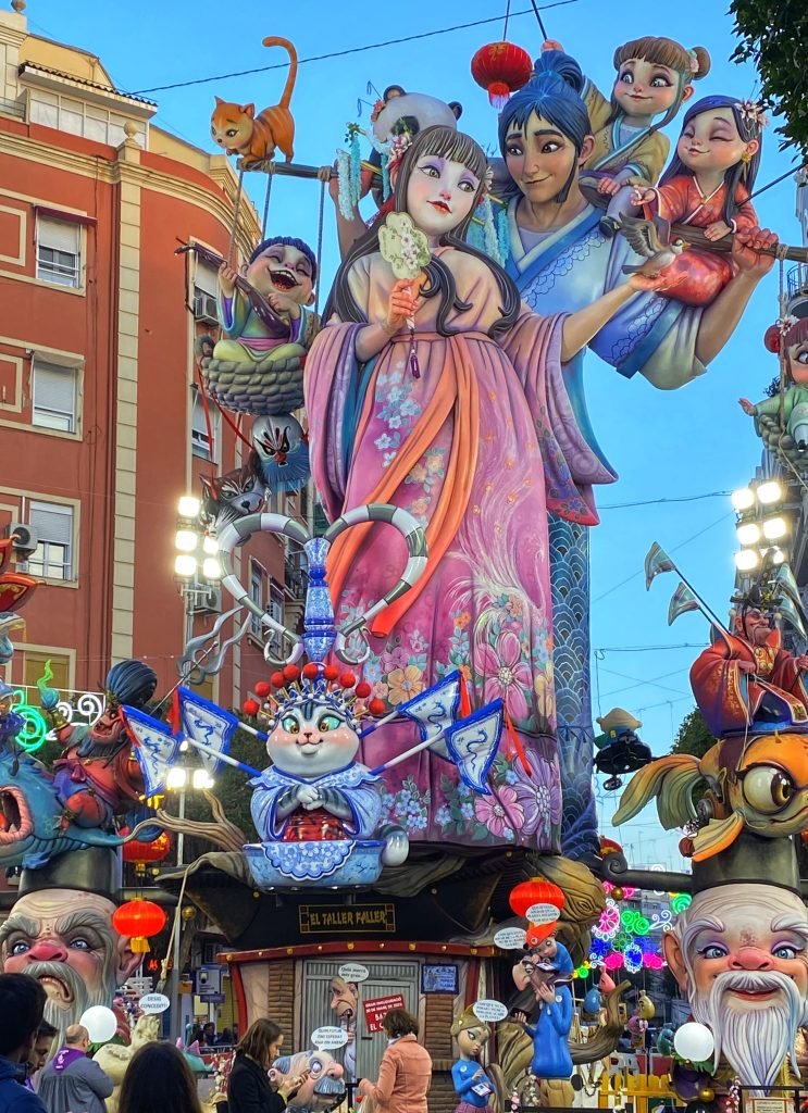 A Fallas with many fanciful creatures as tall as the buildings