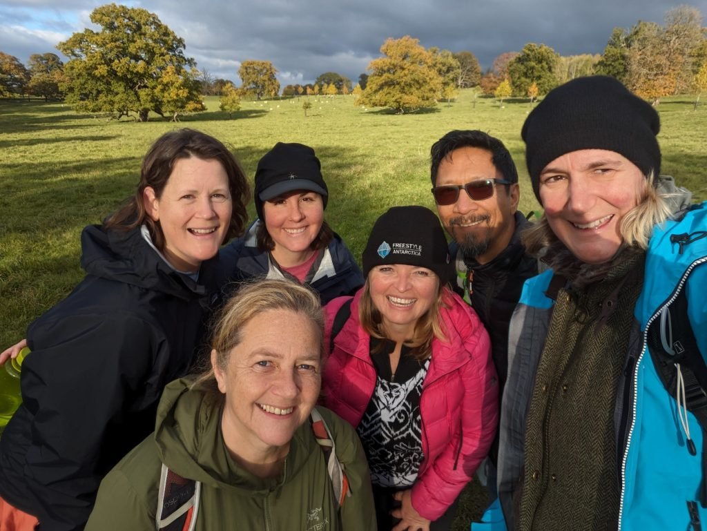 Amber, Sarah, Bonnie, Trin and Kirsten taking a selfie in a field in the Cotswalds.