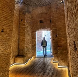 Trin walking through one of the doors in the palace of the Roman Forum