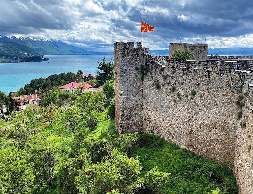 The Fortress wall with the North Macedonian Flag flying in the wind above Lake Ohrid.