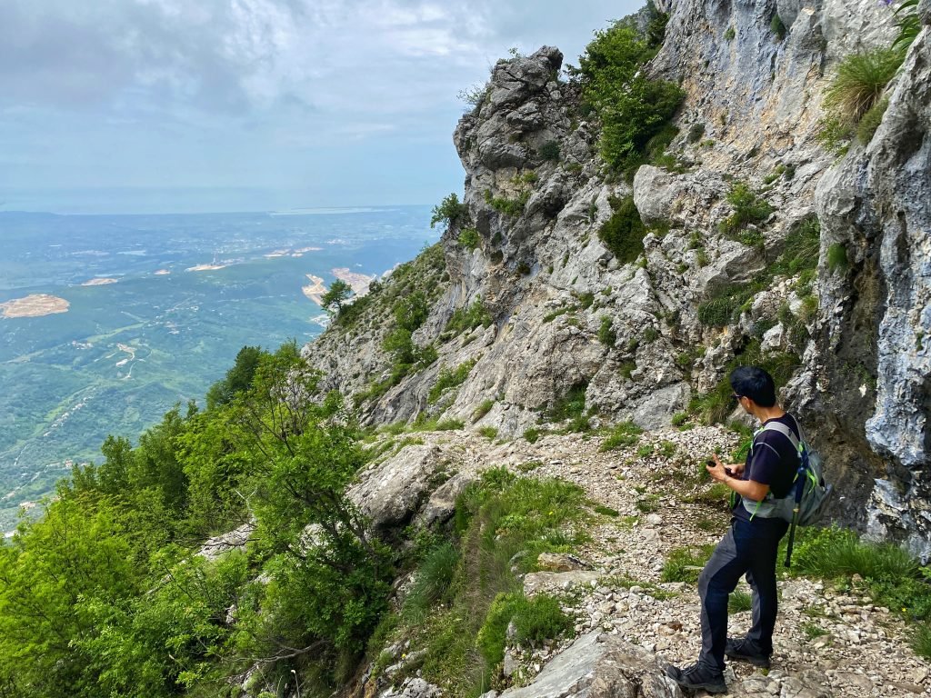 Trin looking back down the trail that leads from Krujë straight up the mountain.