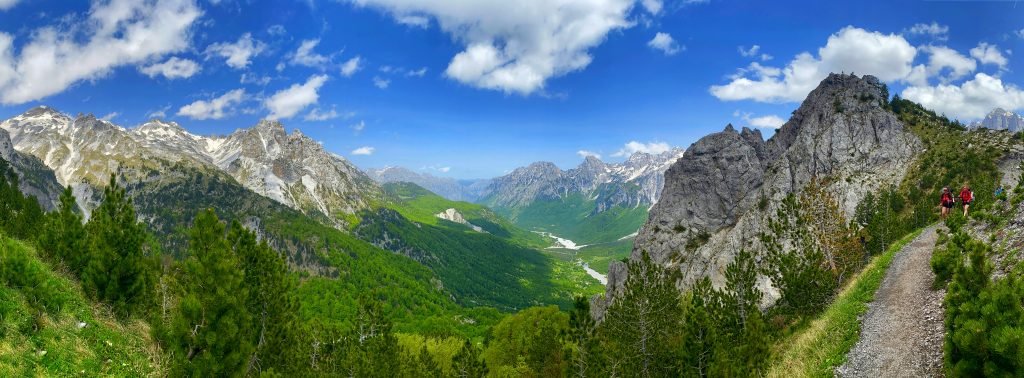 The lush Valbona Valley lined with snow-capped mountains