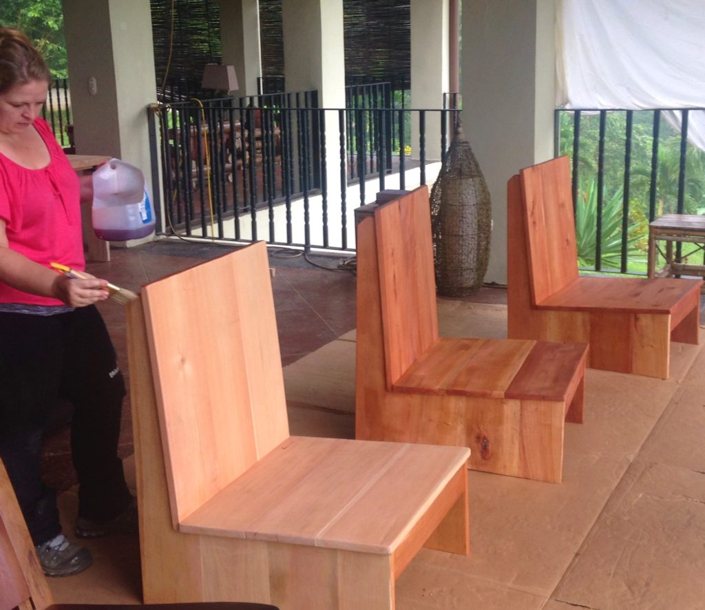 Bonnie varnishing new donated chairs