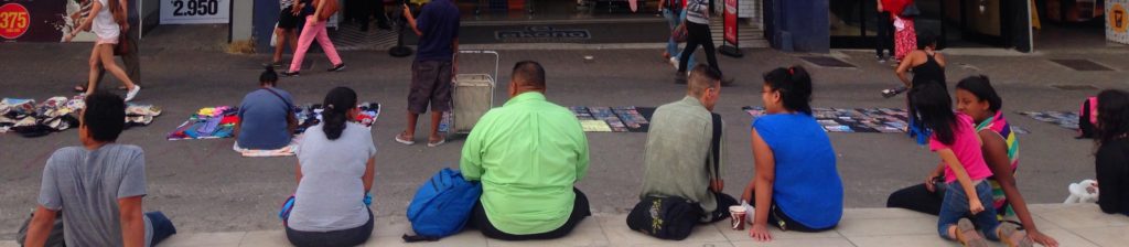 people sitting on the curb
