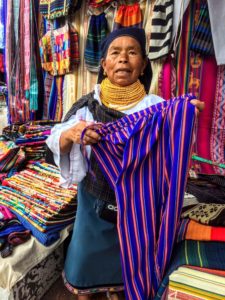 Vendor at Otavalo Market things to do in Ecuador