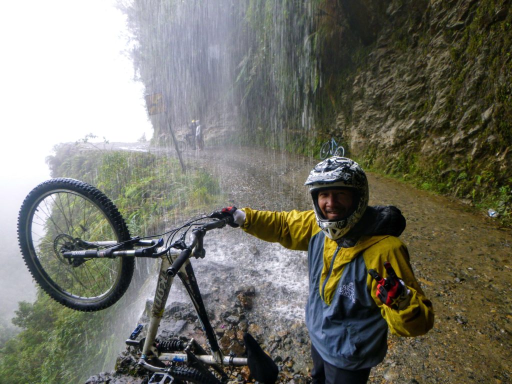 Trin under a waterfall on death road