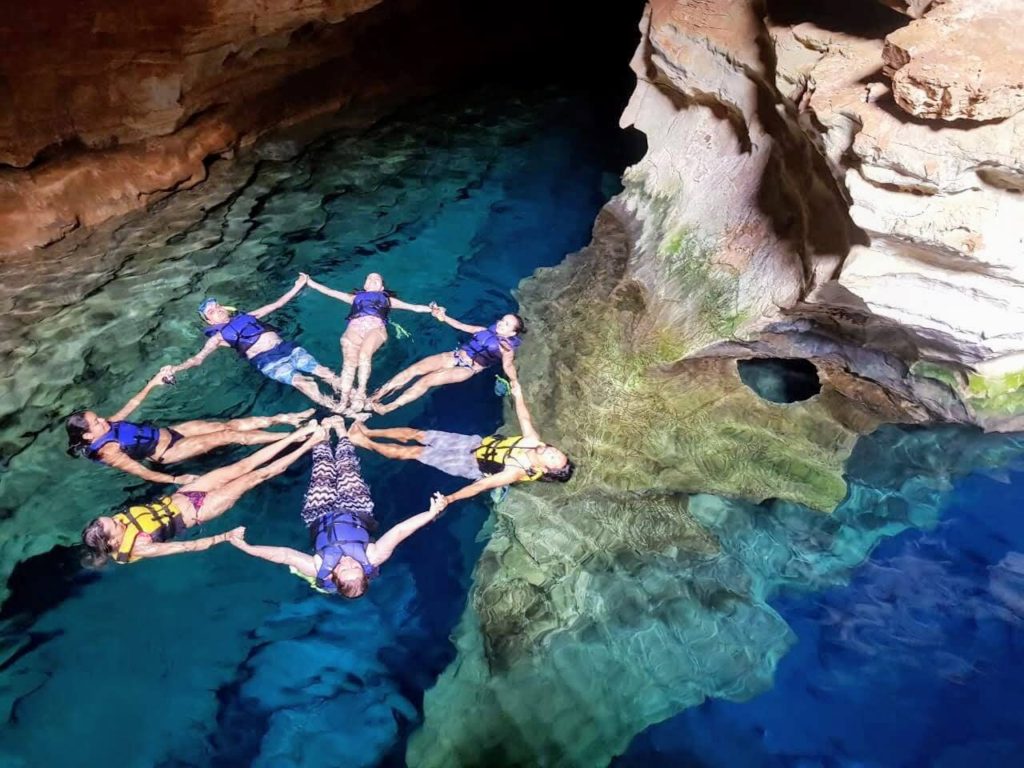 Circle of people in a cave