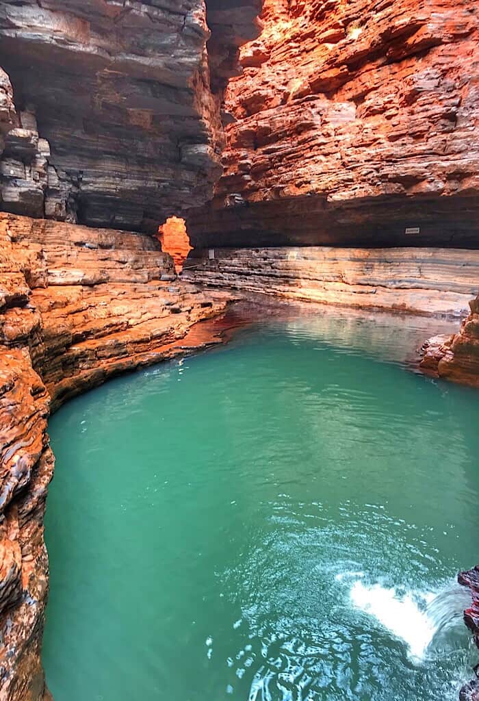 Green pool in a red narrow gorge called Kermit pool in Karijini National Park