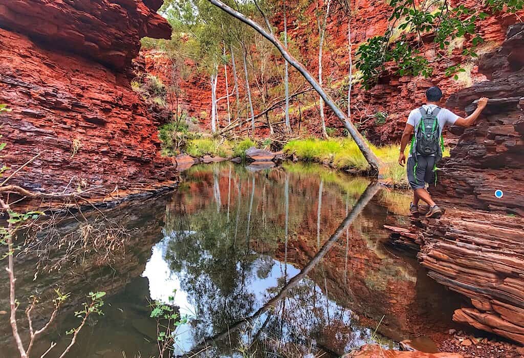 Trin walking to ledge of Weano gorge to keep his feet dry