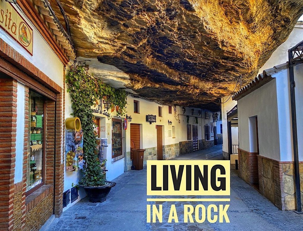 Stores in a cave and a street under a rock