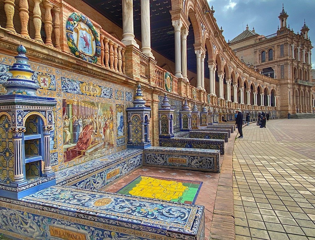 Colorful tiles and pillars at the semi-circle Plaza de España