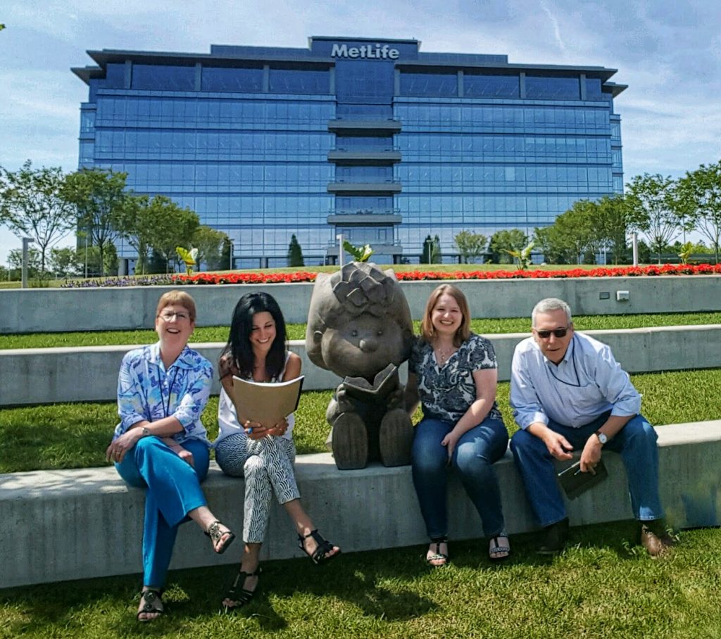 Tina, Gina, Bonnie, and Jeff sitting behind the MetLife building