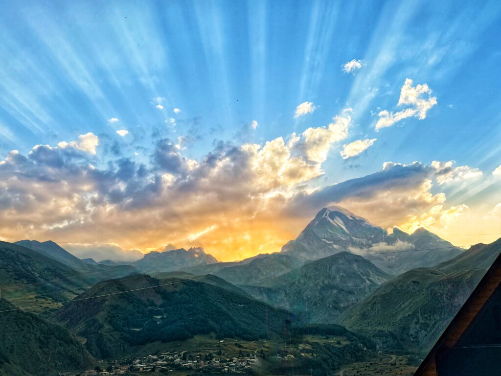 The sun rising over Mt Kazbegi