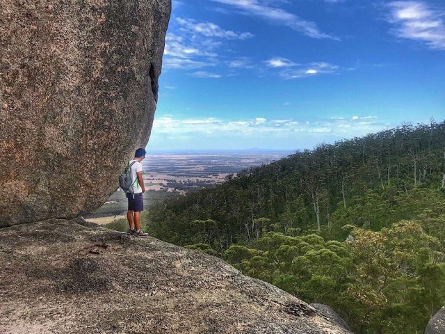 Trin standing on the edge of a granite boulder in Castle Rock Western Australia