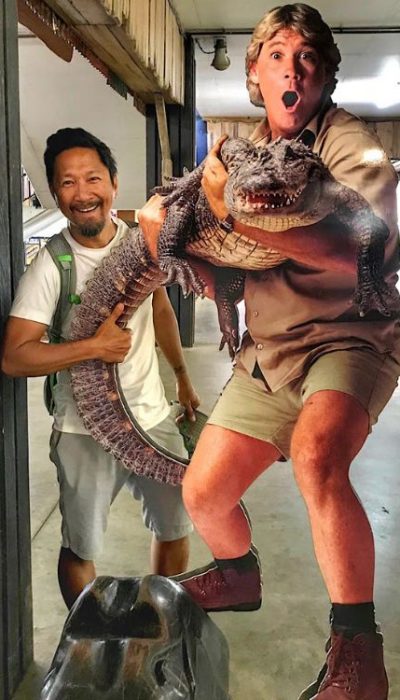 Trin holding the crocodile tail on the Steve Erwin statue